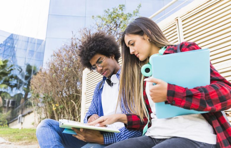 low-angle-view-young-diverse-students-studying-together-front-university-building_Easy-Resize.com