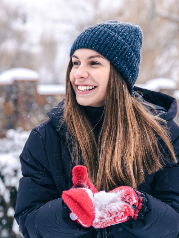 portrait-young-woman-hat-red-mittens-snowy-weather_Easy-Resize.com